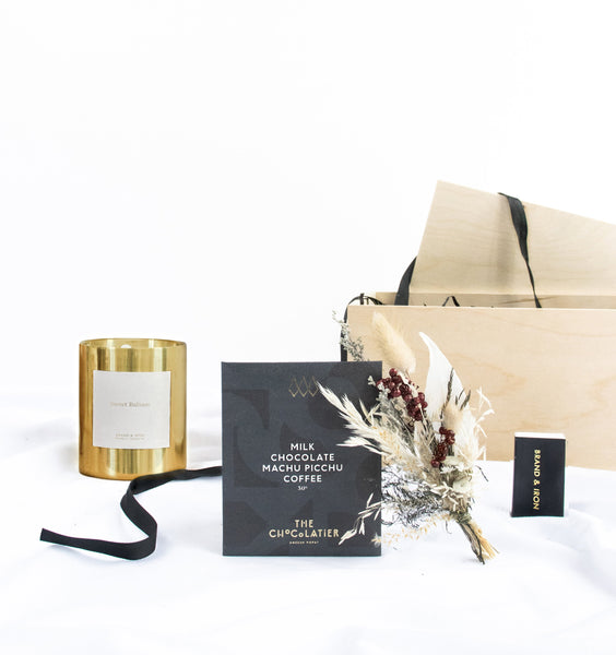Gift box includes gold candle, match box, coffee chocolates, dried floral bundle & wood box.